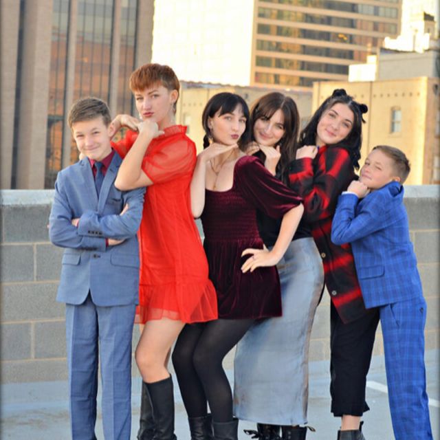 Sharee Hough's six children in different color formal dresses.